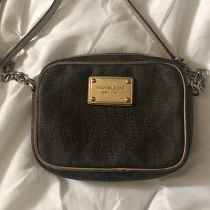 A brown Michael Kors purse